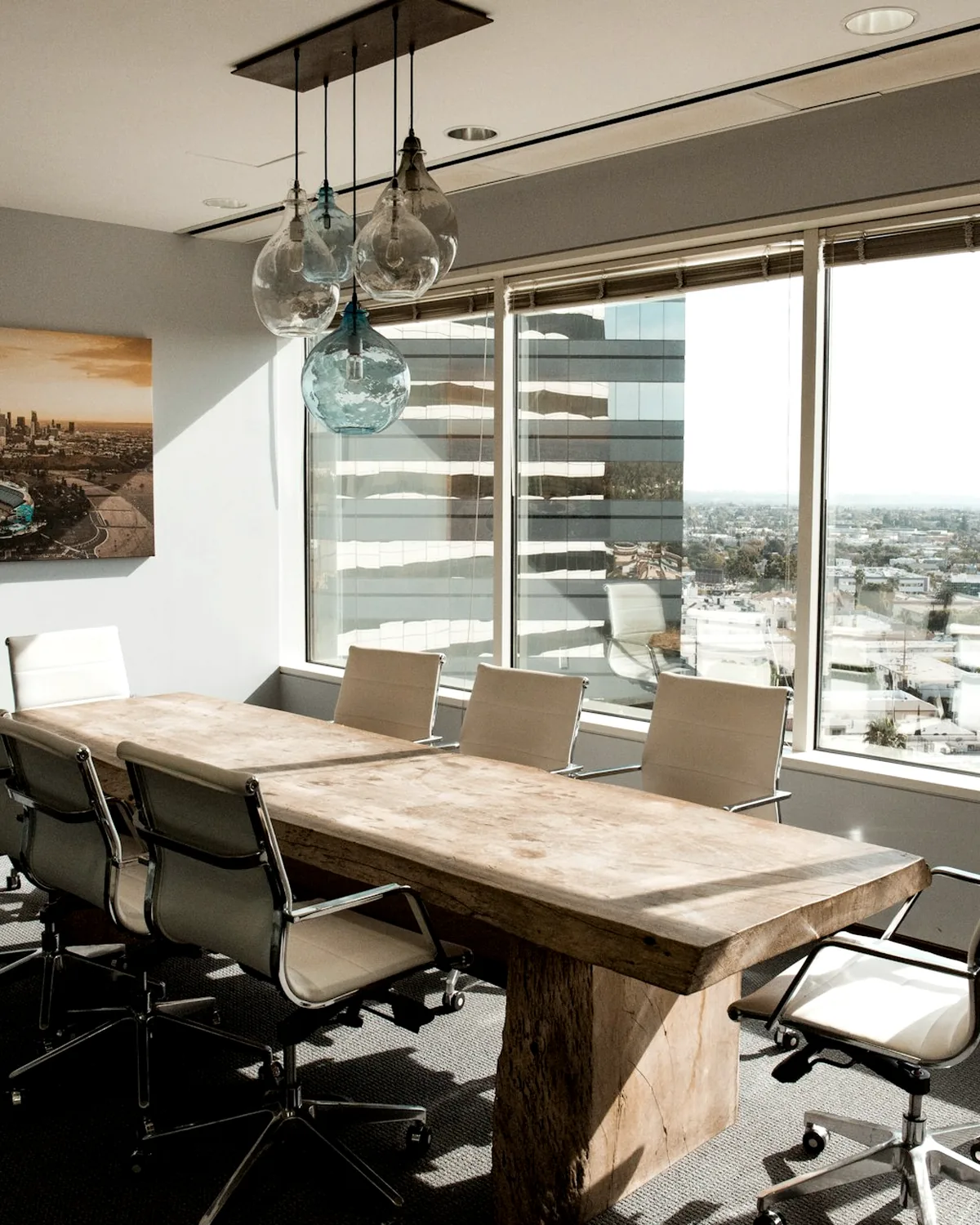 A private boardroom overlooking the city, prepared for a partner-led client meeting.